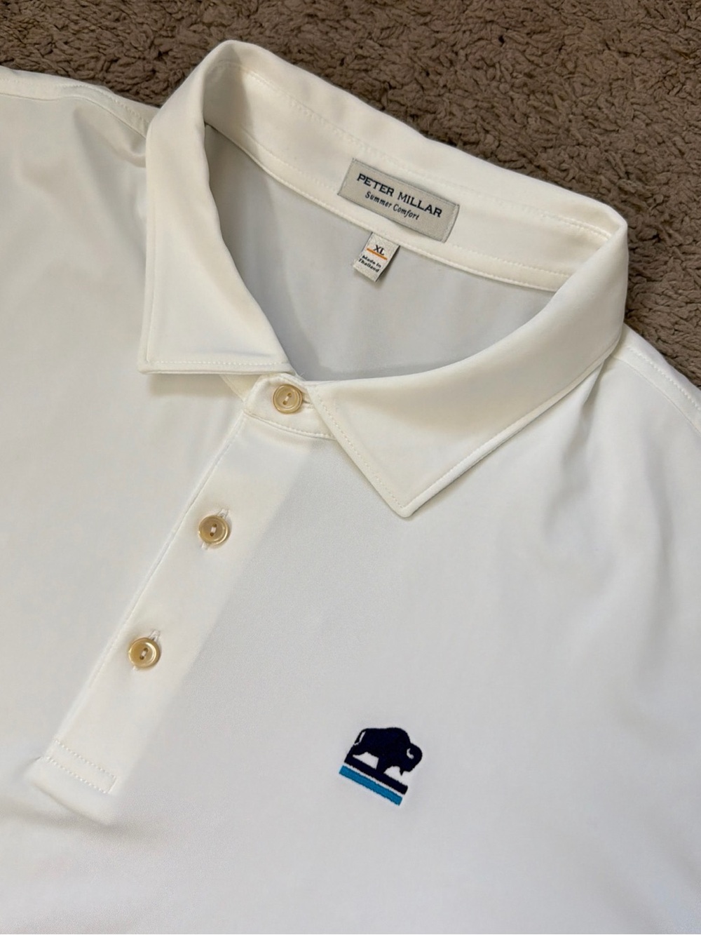 Peter Millar Cream Performance Polo with Navy & Teal Logo